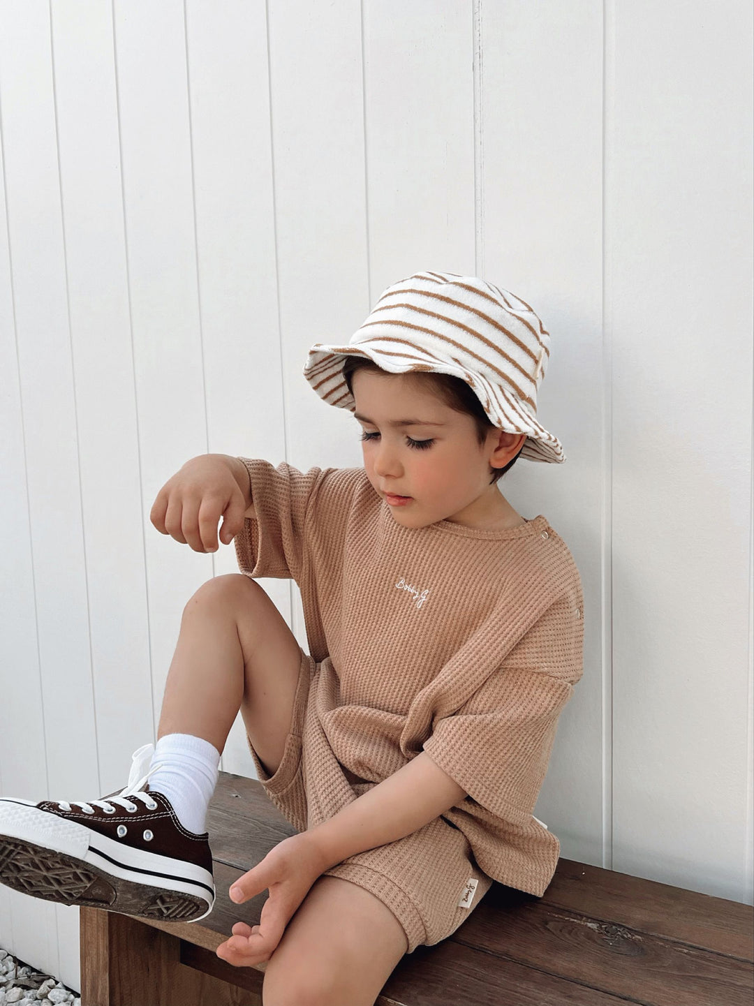 Boy model wearing brown waffle set 