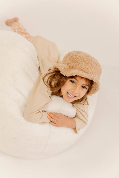 Model wearing kids brown teddy bucket hat 