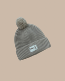 Cotton knit beanie featuring a fun pom pom, neutral hue and our Bobby G woven labelling. 