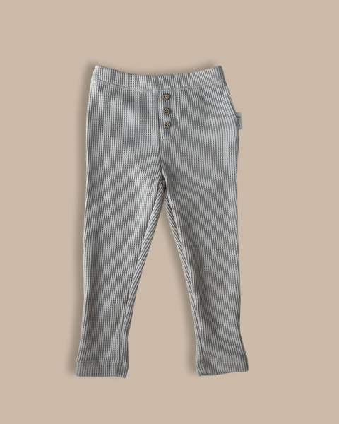 Baby/toddler/kids organic waffle cotton leggings with an elasticated waistband for flexibility and comfort and wooden button detailing and a Bobby G woven label sewn onto the side. 