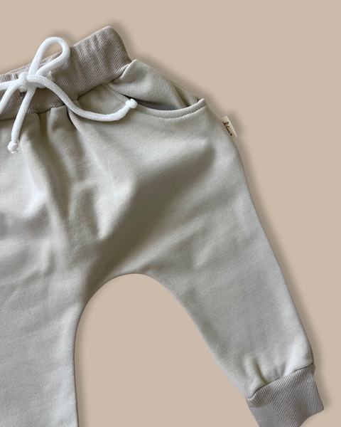 Soft green kids tracksuit bottoms featuring a drop crotch and Bobby G tag. 
