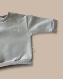 Boxy fit oversized jumper featuring Bobby G embroidery in white available in baby, toddler and kids sizes in a unisex colour palette.