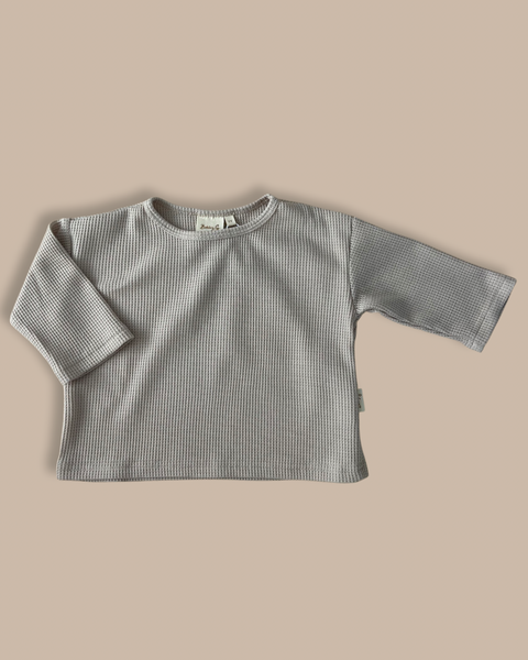 Baby/kids organic cotton waffle box tee in a neutral colour-way with Bobby G tag sewn on the side 