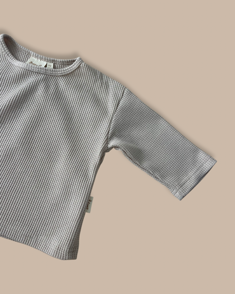 Baby/kids long sleeved boxy tee made from organic waffle cotton in a neutral colour-way with Bobby G branding sewn on. 