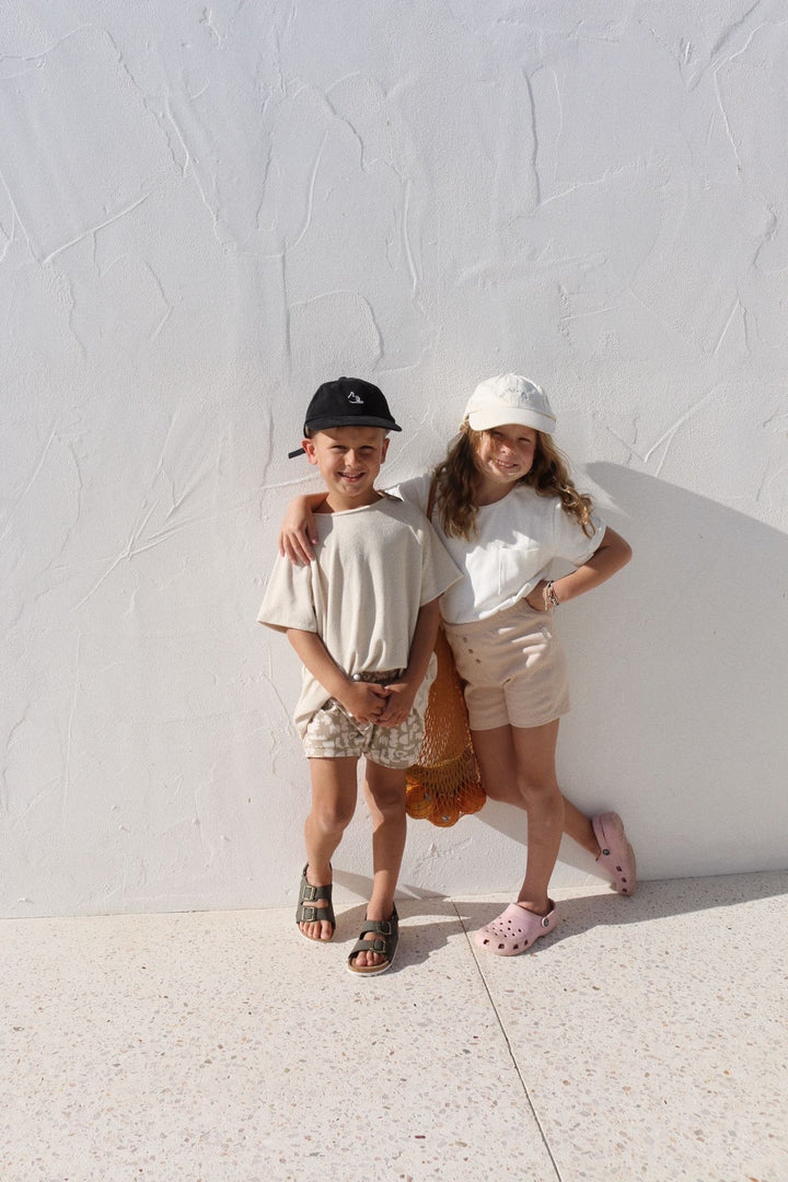 Siblings wearing Summer wardrobe - bike shorts and shorties 