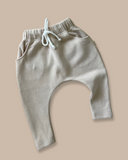Kids cotton knit harem pants with a drop crotch style in a neutral colour-way